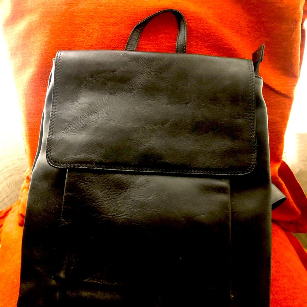 Black Butter-like Leather Unisex Backpack. In excellent condition, rarely used.